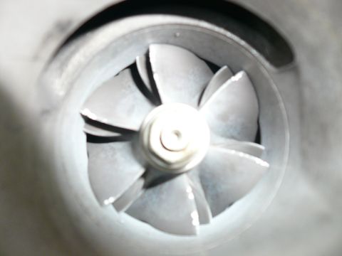 1996 Ford Probe - Turbocharger compressor wheel detail, showing the fan-like blades and central hub.