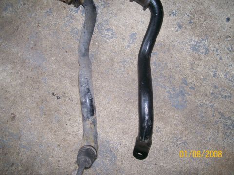 1995 Mercury Grand Marquis - A comparison shows a used, corroded front sway bar next to a newly painted one.