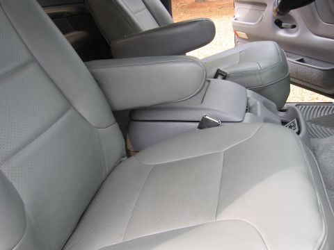 1967 Ford Mustang - Interior view of a vehicle grey leather bucket seats and armrests, with the Supermotors.net logo visible in the lower right corner.