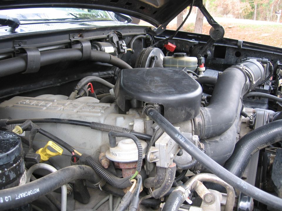 Engine bay with hoses and air intake