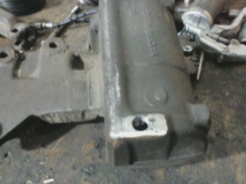 1992 Ford F-350 - This image shows a close-up view of a gray metal vehicle component, likely from an engine or transmission assembly.