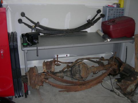 1985 Ford Bronco - Rear 6" chevy leaf packs with old ford stock f250 under the table. Rear dana 60 also.