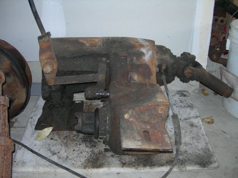 1985 Ford Bronco - This heavily rusted transfer case is a vehicle component, not a complete vehicle.