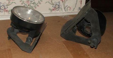 1991 Ford Crown Victoria LTD - Two headlights are shown, one with a mounting bracket, against a floral wallpaper background.