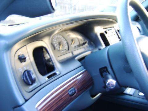 1996 Mercury Grand Marquis - Interior view of a car's dashboard, showing the instrument cluster and steering wheel.