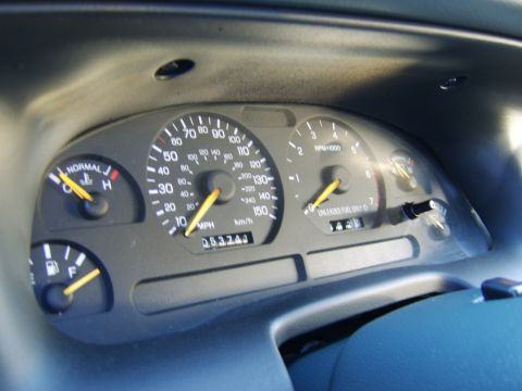 1996 Mercury Grand Marquis - Interior view of the dashboard gauges for a 1996 Mercury Grand Marquis, displaying 63,243 miles.