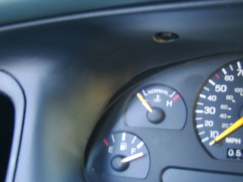 1996 Mercury Grand Marquis - The dashboard gauges display fuel level and engine temperature, with the speedometer indicating speed.