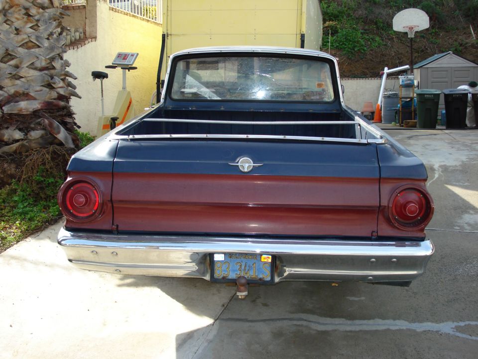 1964 Ford Ranchero rear view, blue and maroon two-tone paint, chrome bumper, visible license plate