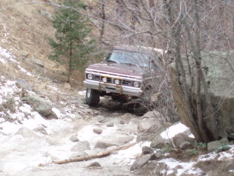 1979 Ford Bronco - This 1978 Ford Bronco is navigating a challenging rocky path with some snow on the ground.