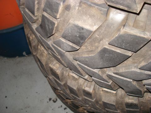 1994 Ford Bronco - Close-up view of the aggressive tread pattern on an off-road tire.