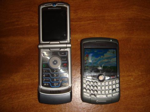 1996 Ford Bronco - Two cell phones, a flip phone and a BlackBerry, are displayed side-by-side on a wooden table.