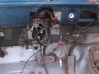 1979 Ford Bronco - Interior view of a vehicle's dashboard, showing exposed wiring and components.