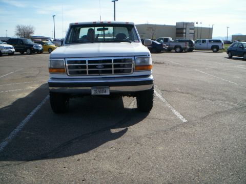 1992 Ford F-250 - Front view of a 1992 Ford F-250 pickup truck in a parking lot with other vehicles.