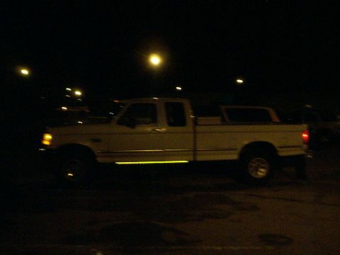 1992 Ford F-250 - This 1992 Ford F-250 pickup truck is seen from the side in this nighttime photograph.