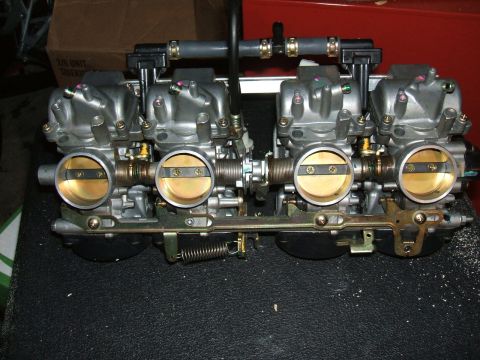 2004 Yamaha FZR600 - Close-up view of a motorcycle carburetor assembly, likely for a multi-cylinder engine.