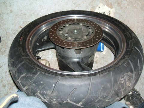 2004 Yamaha FZR600 - A motorcycle's rear wheel and brake disc are shown in this close-up view.