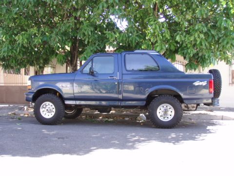 1995 Ford F-150 - This modified Ford Bronco features a unique rear cap and off-road tires.