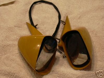 1970 Ford Ranchero - A pair of yellow side mirrors with black wiring are displayed on a towel.