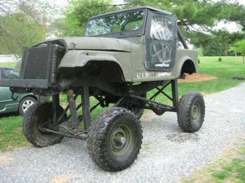 1989 Ford Bronco - This heavily modified Jeep CJ features a significant suspension lift, custom frame, and large off-road tires.