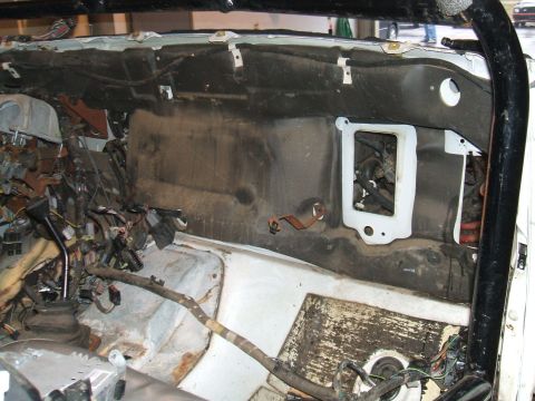 1995 Ford Bronco - Disassembled interior of a 1995 Ford Bronco showing the firewall and exposed wiring.