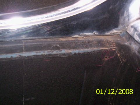 1970 Ford Falcon - This photo shows a close-up of the interior trim of a vehicle, with visible wear and tear.
