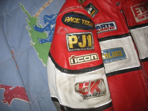 2005 Yamaha R1 - Motorcycle racing jacket with multiple sponsor patches visible on the sleeve and chest area.