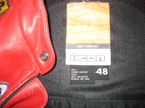 2005 Yamaha R1 - A close-up view of a red leather motorcycle jacket's interior tag and material.