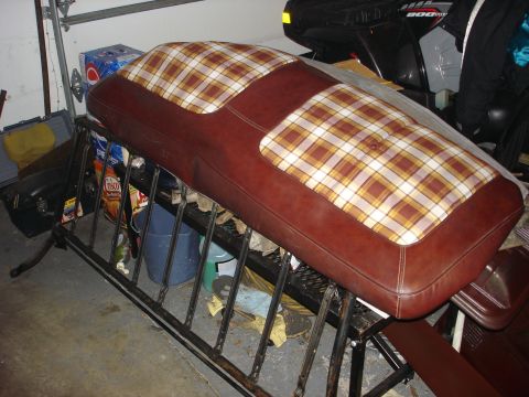 1979 Ford F-150 - Bench seat with brown vinyl and plaid fabric inserts, likely for a vintage truck or SUV.