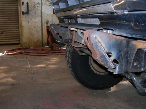 1985 Ford Bronco - Close-up view of custom-welded front bumper mounts on a vehicle, indicating modifications.
