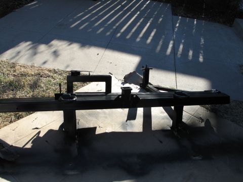 1995 Ford Bronco - A black trailer hitch assembly is shown outdoors, likely after being painted.