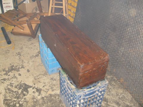 1974 Ford Bronco - Wooden chest resting on stacked milk crates in a garage setting.