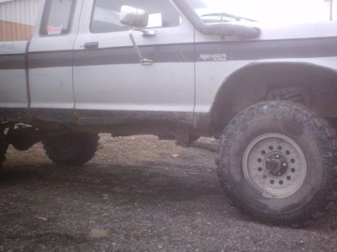 1990 Ford Ranger - Side view of a 1990 Ford Ranger pickup truck with off-road tires.