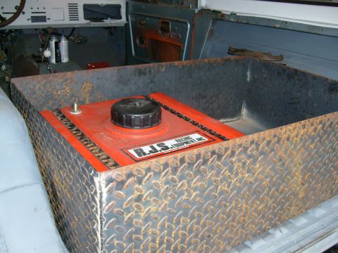 1974 Ford Bronco - An auxiliary fuel tank from R.J.S. Racing Equipment Inc. is installed inside a vehicle's interior.