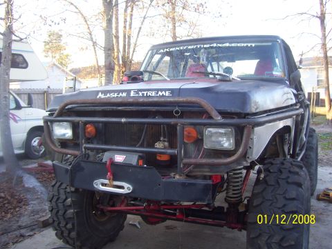 1978 Ford Bronco - This heavily modified SUV features a custom bumper, winch, and "ALASKAN EXTREME" branding.