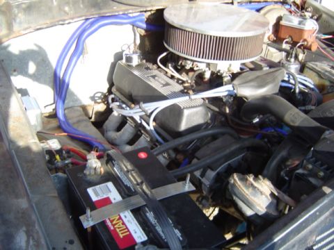 1979 Ford Bronco - Engine bay details with aftermarket modifications visible, including an air filter and battery setup.
