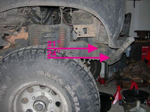 1985 Ford Bronco - Measurements are shown on the suspension components of a vehicle, with a tire in the foreground.