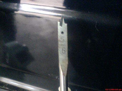 1986 Ford Bronco - A drill bit with size markings is shown close up.