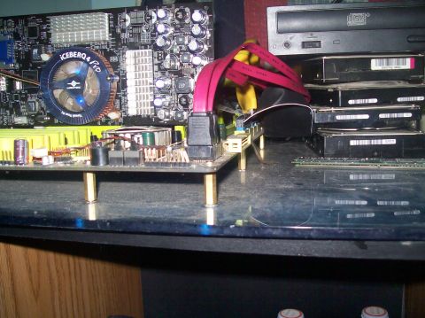 1996 Ford Probe - Close-up view of internal computer hardware, including a motherboard, CPU cooler, and storage drives.