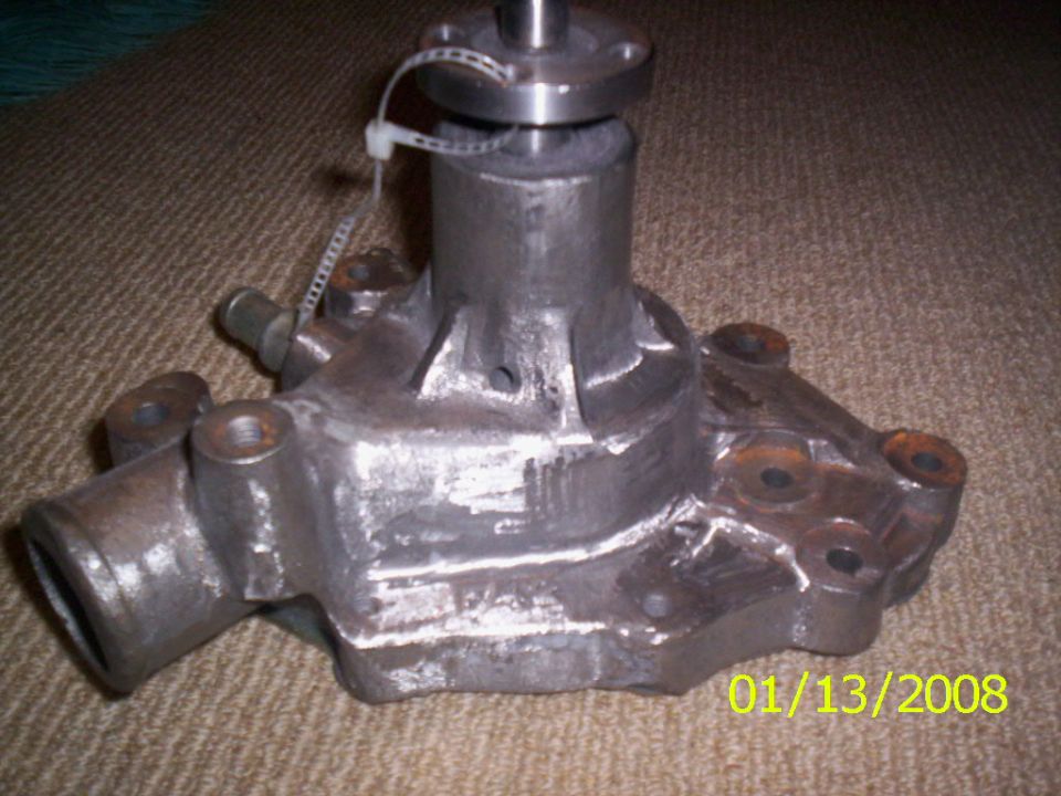 Car water pump on carpet. Date stamp 01/13/2008 and Supermotors.net logo visible