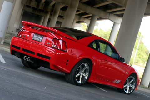 2004 Saleen S-281SC - Red 2004 Saleen S-281SC Mustang coupe seen from the rear 3/4 angle.
