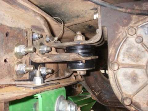 1978 Ford Bronco - This image shows the underside of a vehicle, focusing on the suspension system and its mounting hardware.