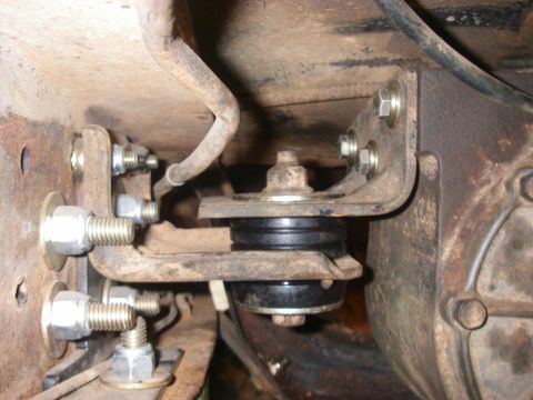 1978 Ford Bronco - This image shows a close-up view of a modified suspension mount, rubber isolators and custom bracketry.