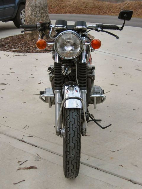 1985 Ford LTD Crown Victoria - Motorcycle front end with chrome details and orange turn signals.