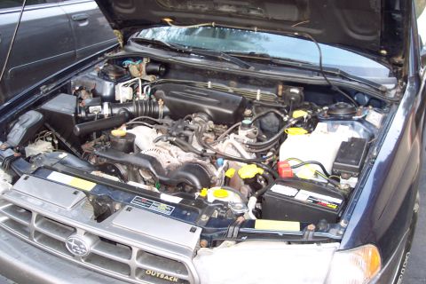 2001 Ford Crown Victoria - Engine bay of a 2001 Subaru Outback, showing the engine and surrounding components.