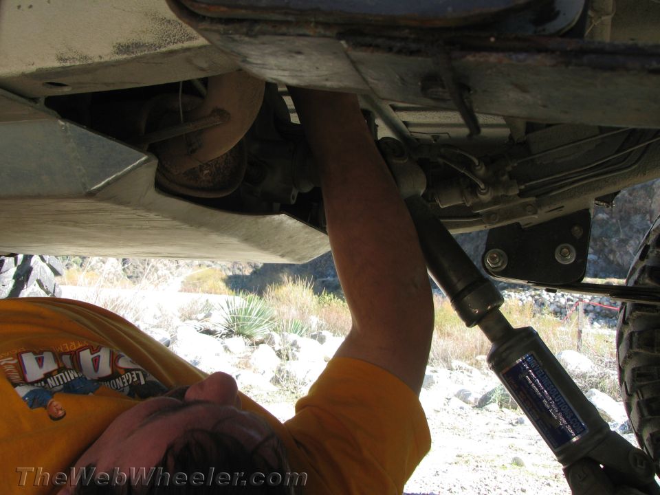 Underbody of a 1987 Suzuki Samurai with a shock absorber visible