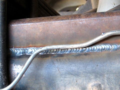 1996 Ford Bronco - A close-up view of a welded metal frame shows stamped numbers '33 33'.