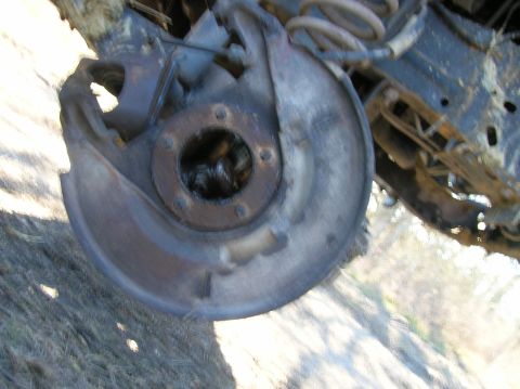 1996 Ford Bronco - Close-up view of a vehicle's front wheel hub assembly, showing wear and tear on the components.