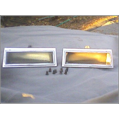 1972 Ford Ranchero - Two side marker lights, one clear and one amber, are shown with their mounting screws.