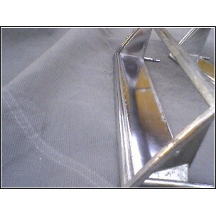 1972 Ford Ranchero - Close-up of a chrome grille piece, likely a car part, with a SuperMotors logo.