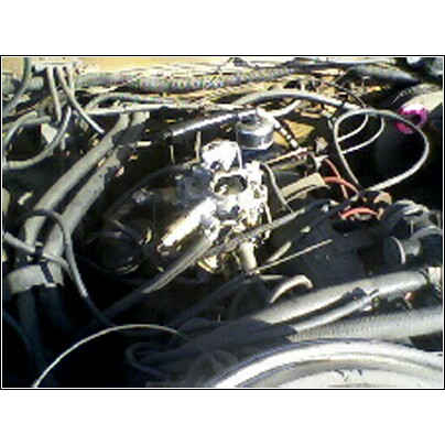 1972 Ford Ranchero - Close-up view of an engine bay, focusing on the carburetor and surrounding components.